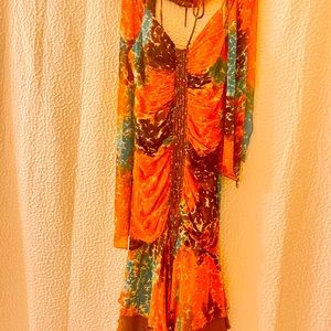 Boho chic great with cowboy boots or strapped heels ! Size 2 gently warn .